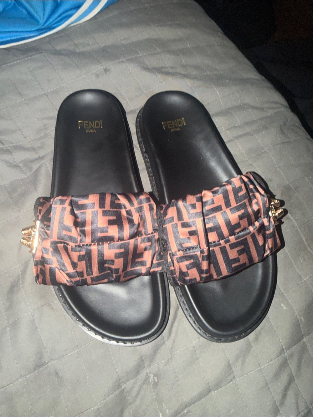 Fendi
Illusion FF Slide Sandals size 42 plastic protector still under thesandals